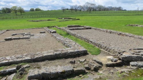 Where the archaeologists have already excavated, the outline of the Roman buildings has been restored.
